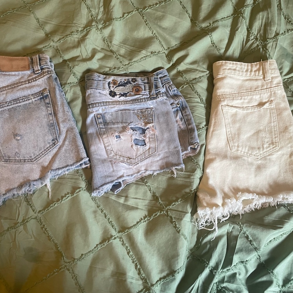Three pairs of size 2 denim shorts.